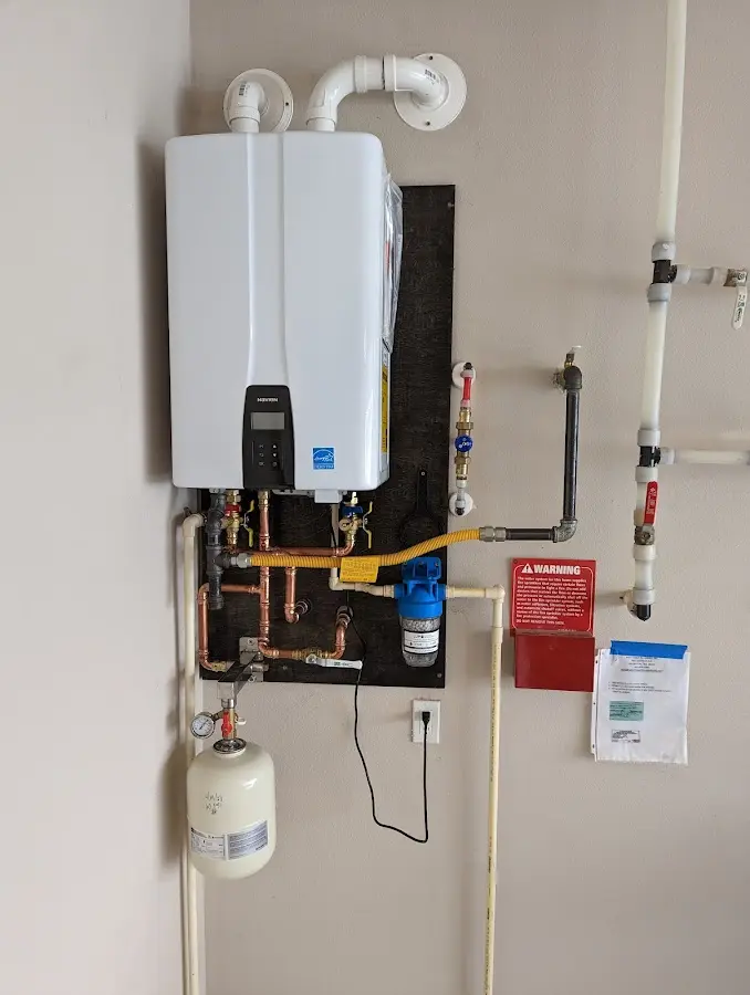 Professional plumber installing copper piping in a Crescent City home